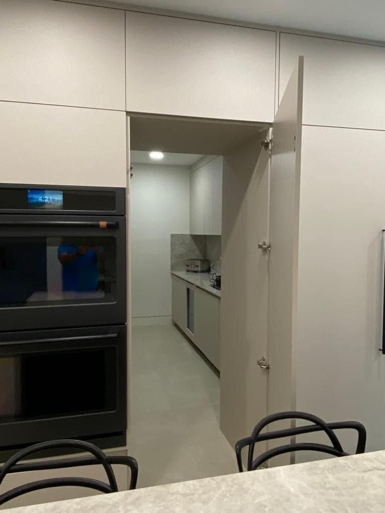 Custom kitchen cabinetry with built-in double ovens