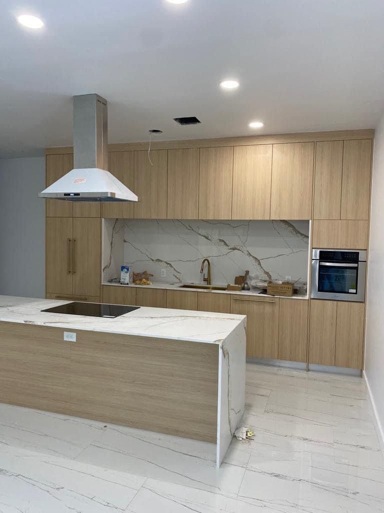 Kitchen island with pendant lighting and stone countertop