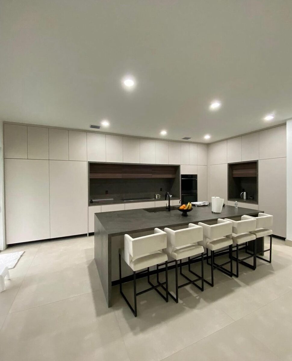 Kitchen with long island and bar seating