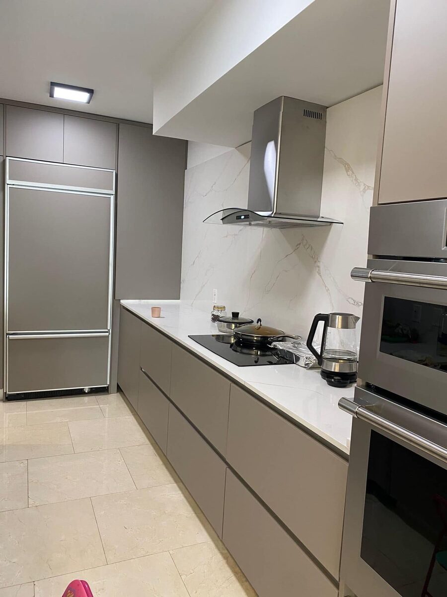 Kitchen with stainless steel built-in refrigerator