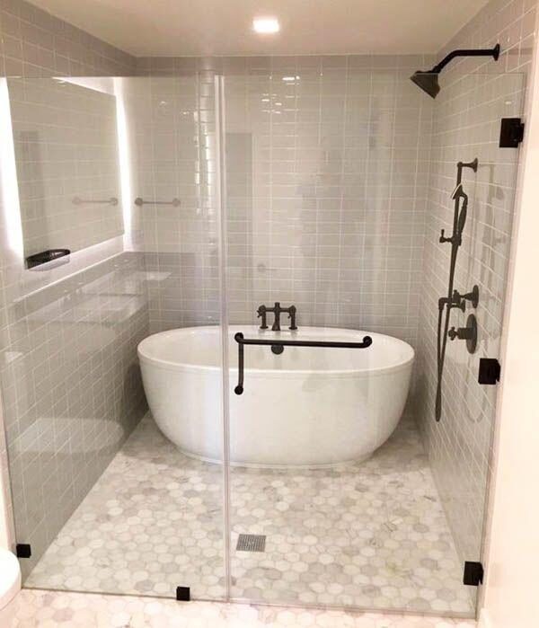Bathroom with freestanding soaking tub and glass shower