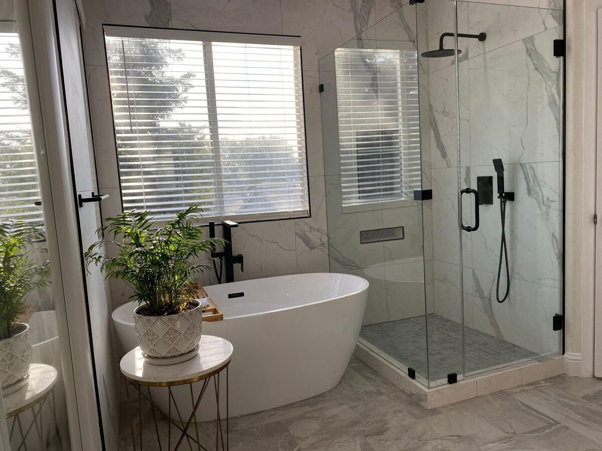 Bathroom with freestanding tub near a window