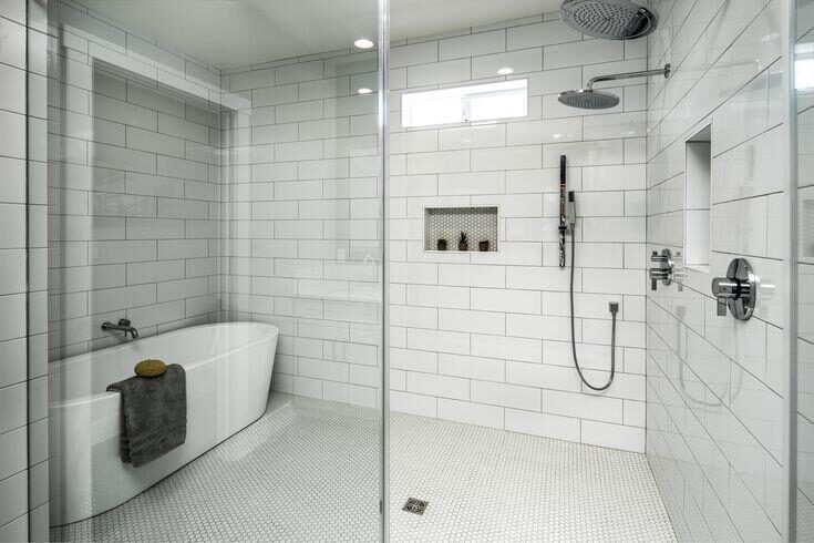 Bathroom with freestanding tub and tile shower