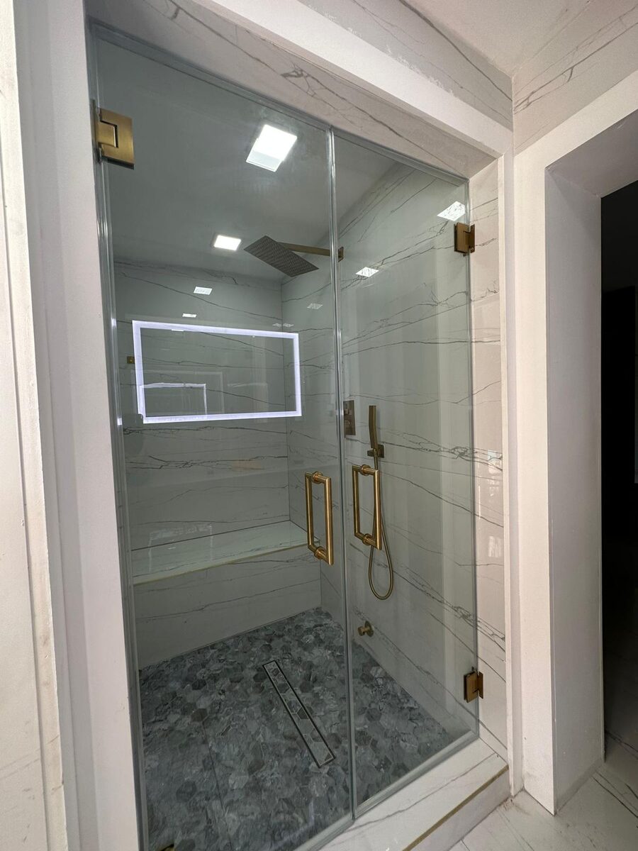 Bathroom with glass shower and skylight