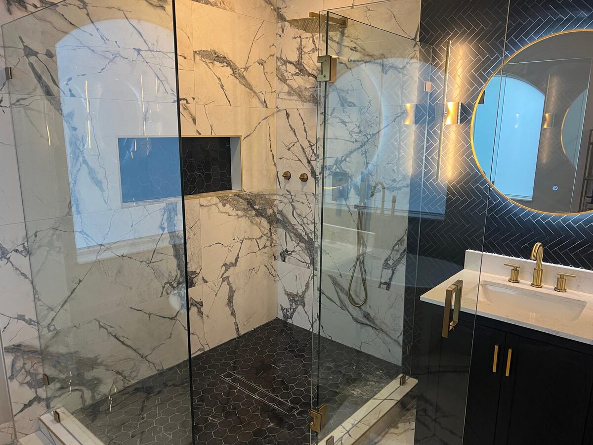 Primary bathroom with freestanding tub and dual vanities